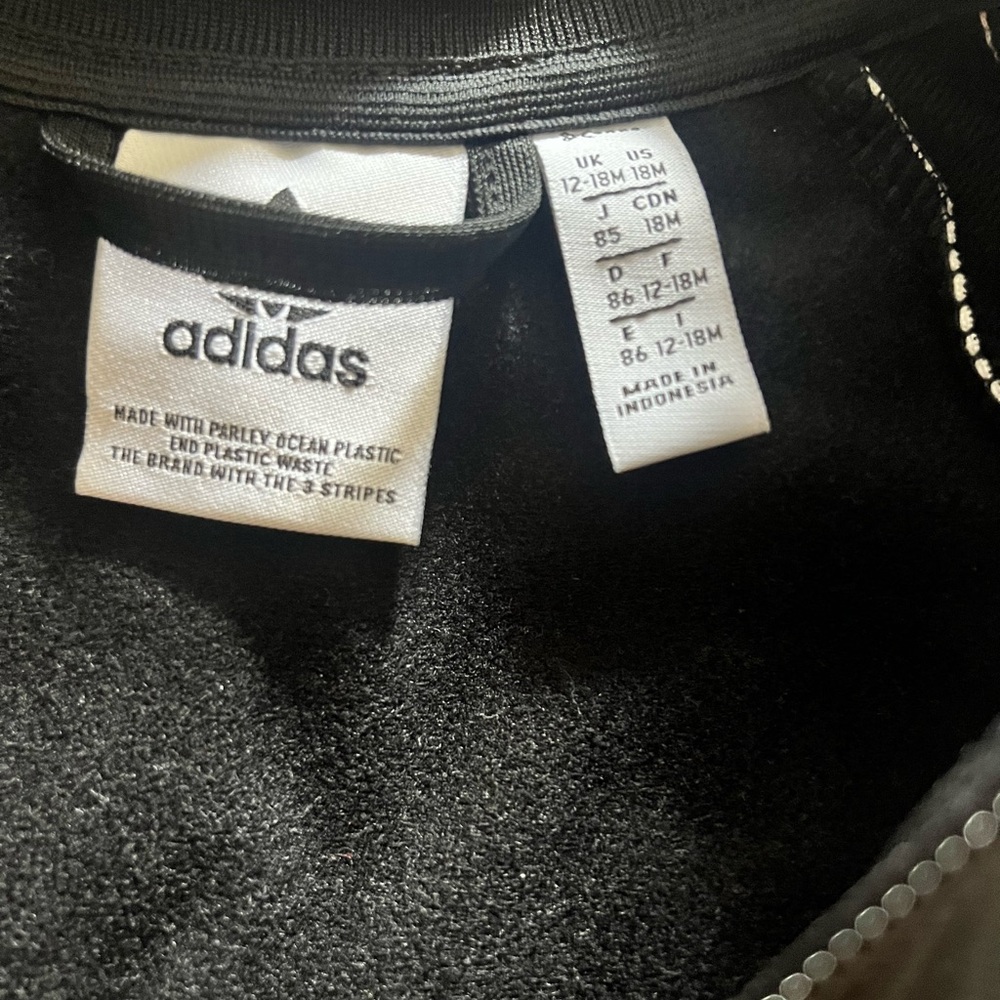 Adidas black & white Track suit. Pants and jacket.  Worn once.